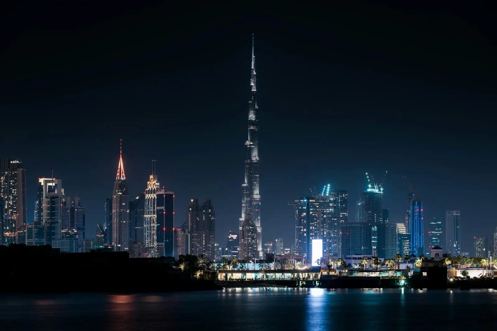 Downtown Dubai and the Burj Khalifa at night, seen across the water
